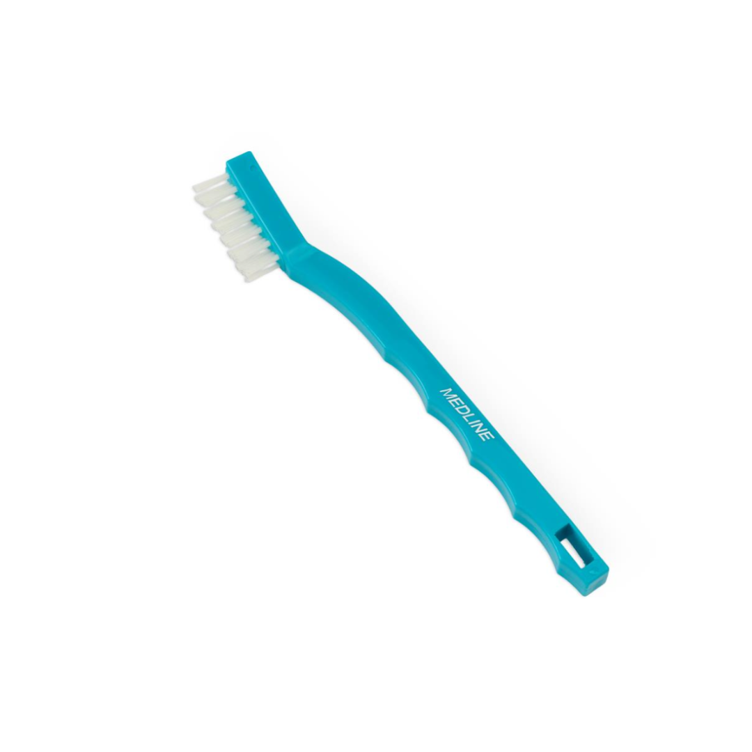 A turquoise Medline Nylon Toothbrush Instrument Cleaning Brush with white nylon bristles and a rectangular hole in the handle is shown on a white background, suitable for instrument cleaning or daily dental use.